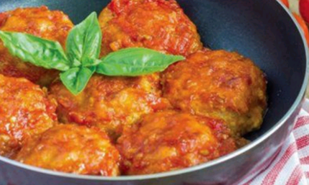 Aromatic fish cutlets in tomato sauce with basil