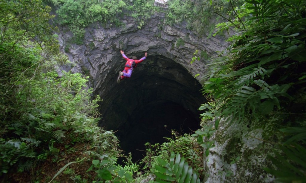 What happens if you drill a through tunnel through the Earth and jump into it?