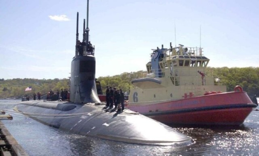 U.S. submarine damaged after collision arrives at base in California